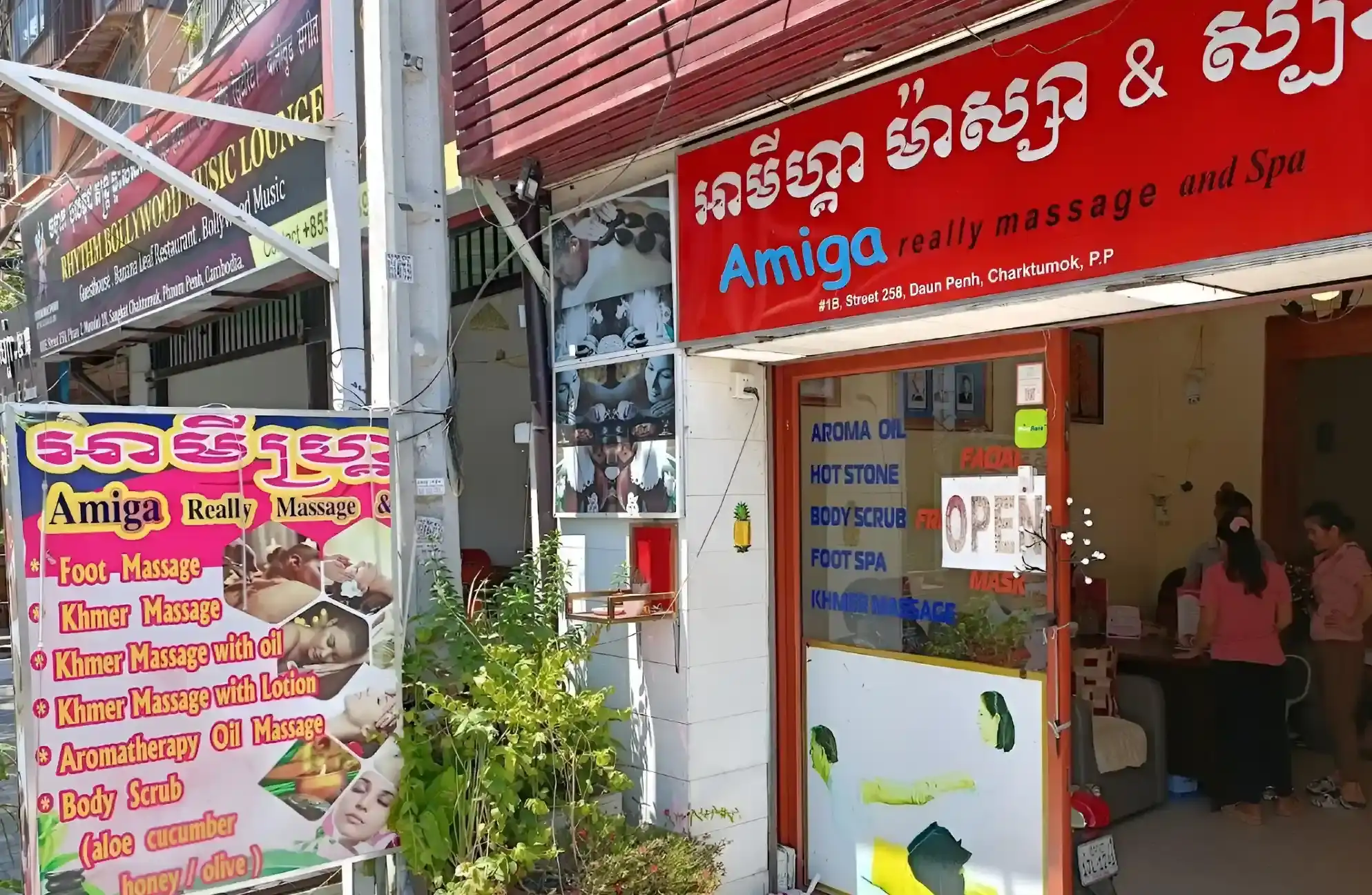 The red shopfront of Amiga Massage and Spa on Street 258, seen from the pavement